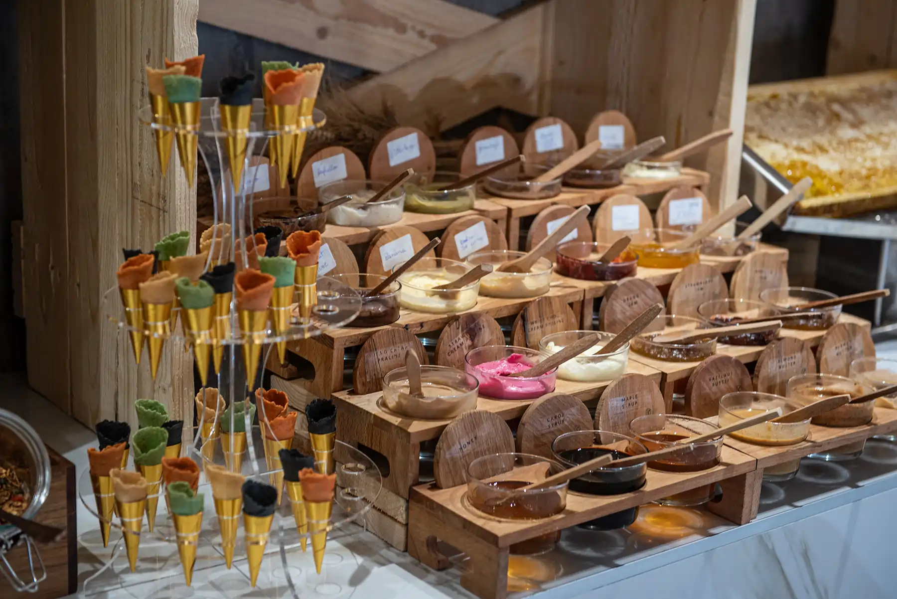 Selection of sweet spreads and dips in glass jars at Bread and Spread buffet