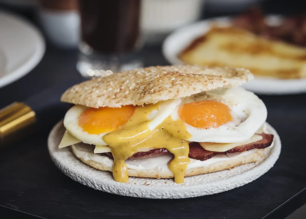 Breakfast sandwich with eggs and mustard sauce at Bread & Spread