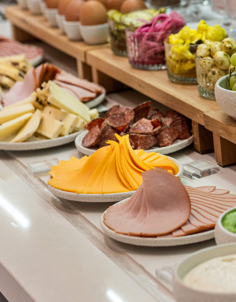 Colorful buffet with fruits, spreads, salmon, and cold cuts at Bread & Spread